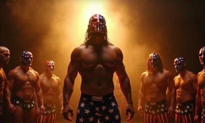 El Grande Americano in mask and singlet backstage with WWE RAW faction